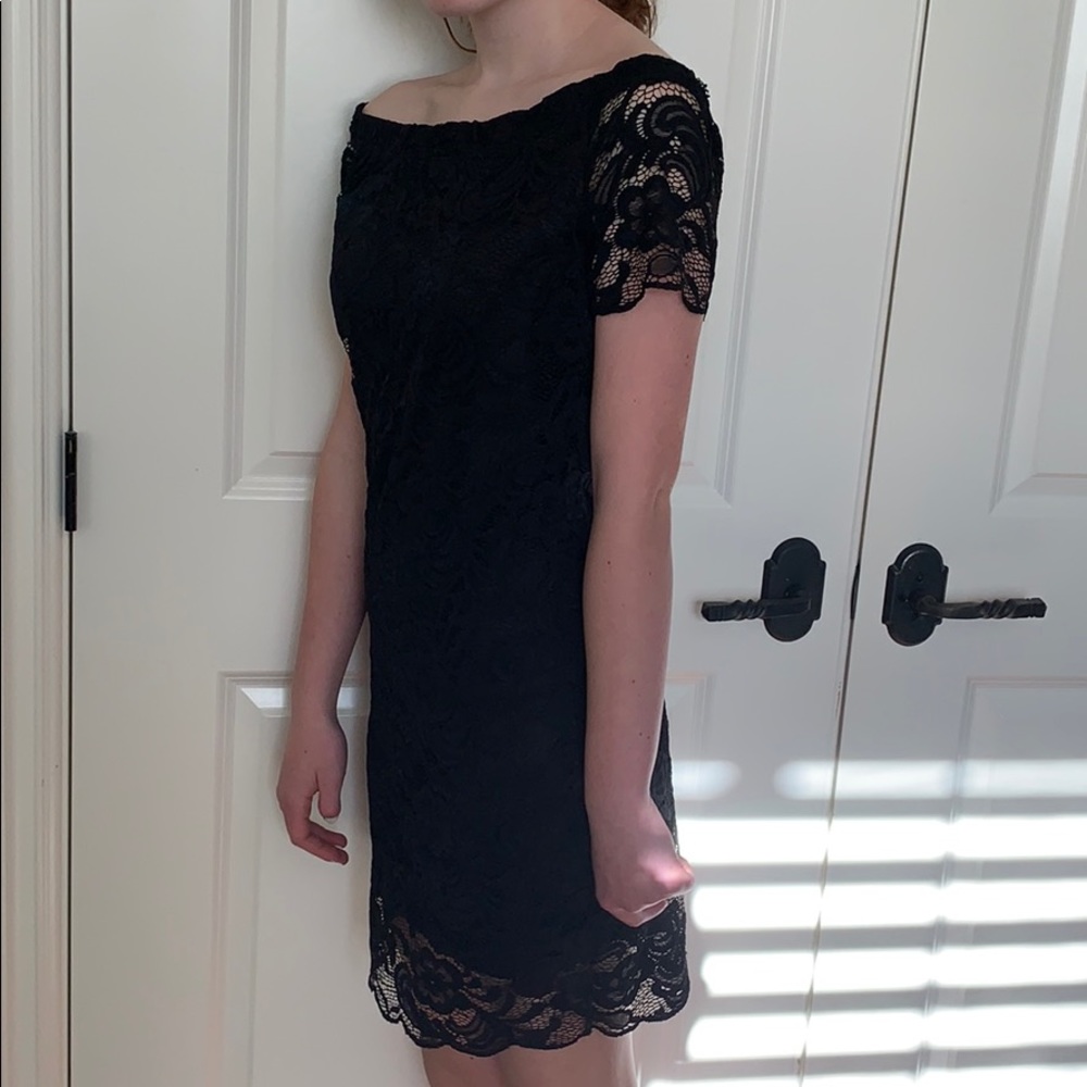 Off the shoulders black dress.